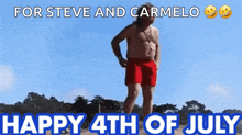 a shirtless man in red shorts stands on a beach with the words " for steve and carmelo happy 4th of july " above him