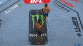 a can of monster energy is laying on the ground