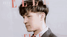 a man in a suit and tie is on the cover of elle