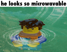 a picture of a lego man in the water with the caption he looks so microwavable
