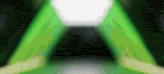 a green light is shining through a dark room