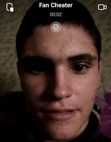 a close up of a man 's face with the words fan cheater visible
