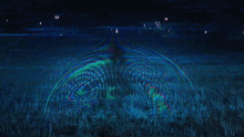 a blurry picture of a field of grass with a blue and red background
