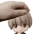 a hand is touching the head of a small anime character .
