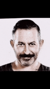 a black and white photo of a man with a beard and jem.beyle written below it
