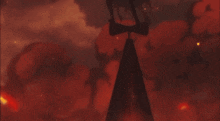 a group of people standing in front of a burning city
