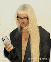 a woman with blonde hair and glasses is holding a phone