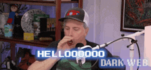 a man wearing a hat is sitting in front of a microphone and saying hello 000000 dark web .