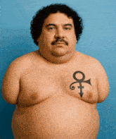 a man without a shirt has a tattoo on his chest that looks like a prince symbol