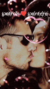 a man and a woman are kissing in front of soap bubbles and the word pantera