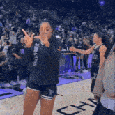 a woman wearing a black hoodie that says valkyries