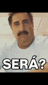 a man with a mustache is wearing a white shirt with the word sera written on it