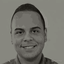 a black and white photo of a smiling man with a myheritage logo on the bottom right