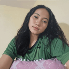 a painting of a woman wearing a green shirt