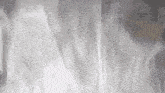 a close up of a white cloth with a smoke coming out of it .