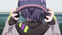 a girl with purple hair is holding a steering wheel in her hands .