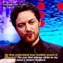 a man in a suit and tie is talking about robert redford 's scottish accent
