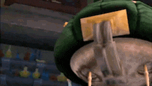 a cartoon character is sitting on a couch with a card on the back of it .