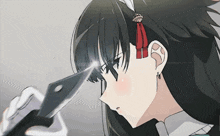 a girl with a red ribbon in her hair is holding a knife to her head