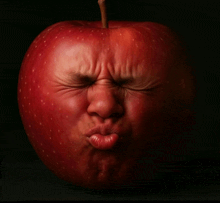 a red apple looks like a person with their eyes closed