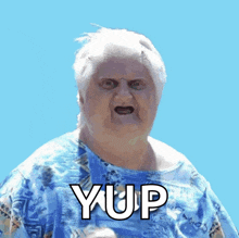 a woman in a blue shirt with the word yup written on it