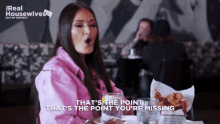 a woman in a pink jacket says that 's the point that 's the point youre missing