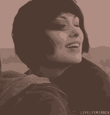 a black and white photo of a woman with the words livelyemirock written on the bottom