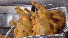fried chicken in a basket that says made in animatica on the bottom