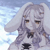 a girl with bunny ears is holding a cell phone