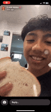 a young man is holding a slice of bread in front of his face with claire berra written on the bottom right