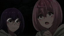 a girl with glasses and a pink haired girl with a surprised look on her face