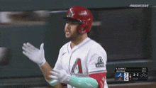 a baseball player wearing a white jersey with the letter a on the front
