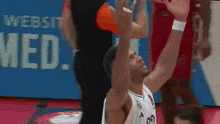 a basketball player with the number 29 on his jersey shoots a shot