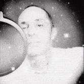 a black and white photo of a man wearing ear buds and a microphone with the name winter written on the bottom