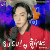 a man wearing headphones and a red shirt says susu in a foreign language