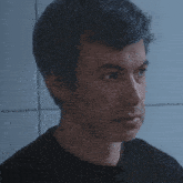 a close up of a man 's face with his eyes closed