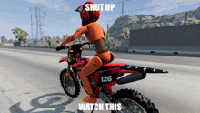 a red dirt bike with the number 126 on the back