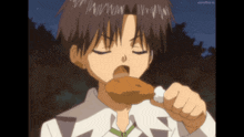 a boy is eating a piece of chicken with a watermark that says soundcloud.tv on it