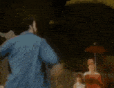 a painting of a group of people in a park with dogs