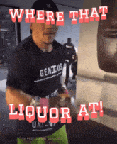 a man wearing a shirt that says " genius " is standing in front of a punching bag