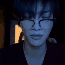 a close up of a person wearing glasses