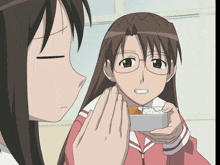 a girl in glasses is holding a box of food in her hand