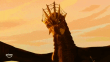 a dragon with a crown on its head is on a prime ad