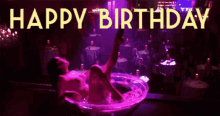a woman is laying in a martini glass with the words happy birthday written above her