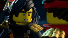 a close up of a lego figure with a black hair
