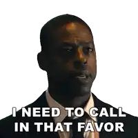 a man in a suit and bow tie says i need to call in that favor