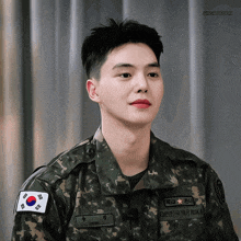 a young man in a military uniform has a name tag that says ' jungmeon ' on it