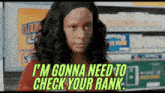 a woman is standing in front of a shelf in a store and saying `` i 'm gonna need to check your rank ''