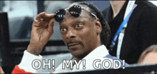 snoop dogg is wearing sunglasses and says " oh my god "