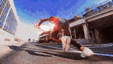 a man in a spiderman costume is running down a street in a city .